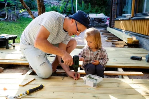 Father and child working together on a home renovation project